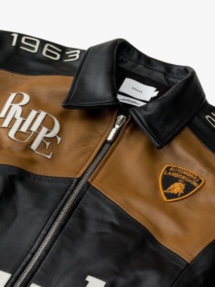 Rhude 63 Leather Racing Jacket - Channel the spirit of the race with the Rhude 63 Leather Racing Jacket, a sleek and edgy piece inspired by racing aesthetics for a bold and stylish look."